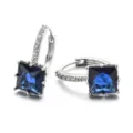 Close-up view of elegant square blue zircon hoop earrings with sparkling pavé crystals. - Sapphire Blue