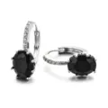 Silver huggie earrings featuring black oval cubic zirconia and pave white stones for women. - Black