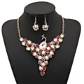 Exquisite peacock jewelry set featuring stunning pink rhinestones and gold-tone alloy for women. - Rose Red