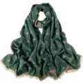 Detailed view of the dark green women long scarf shawl with gold polka dots and short fringe. - 06