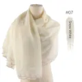 Detail view of cream white chiffon scarf with delicate embroidered heart scalloped edges. - Snow White