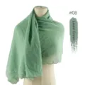 Close up view of laurel green chiffon hijab scarf with delicate heart embroidery details. - Laurel Green