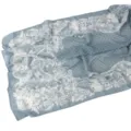 Detailed close-up view of a soft blue chiffon scarf featuring elegant white floral patterns. - 72
