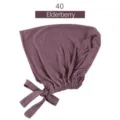 Gorro de modal con lazo para mujer, cómoda cofia elástica en un elegante color elderberry. - Saúco