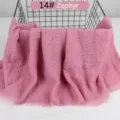Detail view of lightweight breathable cotton linen solid color crinkled scarf with tassel fringe. - Zephyr