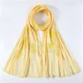 Detail view of the crinkle chiffon embroidered long scarf with metallic yarn and floral pattern. - 175*75cm / Yellow