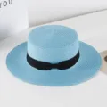 Blue flat top straw hat with black bow ribbon detail, perfect summer beach sun protection. - M (56-58cm) / Sky Blue