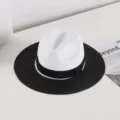 Close-up details of a chic two-tone straw hat featuring a white crown and wide black brim. - M (56-58cm) / Black