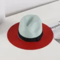 Detailed view of women summer straw hat with mint crown, red wide brim and black bow ribbon. - M (56-58cm) / Red And Green