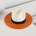 Elegant summer straw hat with a wide orange brim, white crown, and chic black ribbon. - M (56-58cm) / Orange
