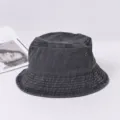 Vue détaillée du chapeau bob en denim noir vintage lavé avec œillet métallique pour l'extérieur. - M (56-58cm) / Noir
