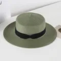 Green straw hat detail showing the fine woven texture and elegant black ribbon bow decoration. - M (56-58cm) / Army Green