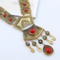 Retro vintage gold-toned statement necklace with red gemstone and tassel charms for women. - Antique Gold Red