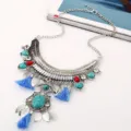 Detailed view of bohemian retro turquoise gemstone leaf tassel statement necklace for women. - Blue