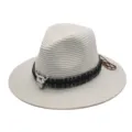Detailed view of the ethnic style straw fedora hat, featuring a woven band and bull skull decor. - M (56-58cm) / Cream