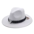 Detailed view of the white straw fedora hat with ethnic band and metal bull skull decor for summer beach. - M (56-58cm) / White