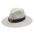 Detail view of white straw fedora hat featuring brown leather band with metal studs and bull skull. - M (56-58cm) / Cream