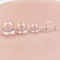 Dettaglio perline tonde in acrilico trasparente, confronto dimensioni per accessori gioielli. - 4mm / Trasparente