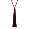 Long beaded sweater chain with a rich brown silk tassel pendant, elegant jewelry detail shot. - Coffee