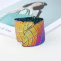 Wide iridescent leaf cuff bracelet detail, colorful metallic leaf pattern open arm bangle. - Colorful