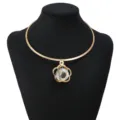 Vintage gold metal choker necklace featuring hollow flower crystal pendant detail style - Plum Blossom