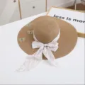 Detail of summer straw sun hat with wide brim, pink ribbon bow and cute butterfly embroidery. - M (56-58cm) / Khaki