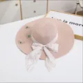 Pink straw sun hat with floral ribbon bow and delicate butterfly embroidery details. - M (56-58cm) / Pink