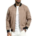 Khaki suede bomber jacket detail view, featuring metal snap buttons and black ribbed collar. - Brown