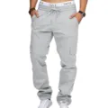 Detailed view of men's light grey cargo pants featuring multiple pockets and drawstring waist. - S / Light Gray