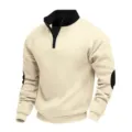 Detail view of the half-zip fleece sweatshirt highlighting contrast collar and elbow patches. - Apricot