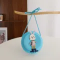 Blue woven straw crossbody bag detail featuring cute rabbit decoration for children daily use scene. - Sky Blue