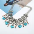Exaggerated retro statement necklace with turquoise stones, vintage silver alloy and tassels. - Antique Silver