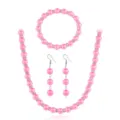 Rosa Perlen Schmuck Set Detail mit funkelnden Strasssteinen für elegante Akzente. - Rosa