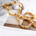Detail view of yellow irregular acrylic stone chip beads, perfect for DIY jewelry making. - 10 Pieces/Pack / Yellow