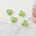 Green butterfly bead detail shot, alloy DIY jewelry accessory, close-up view of size and hole. - Green