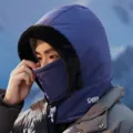 Detailed view of winter thermal cycling hood with plush trim and integrated face mask design. - One Size / Navy Blue
