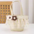 Close-up of children's mini straw woven handbag featuring lace trim and cute crochet flowers. - 17x14x6.5 / Beige