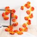 Artificial maple leaf vine decoration, vivid autumn plant garland for indoor and outdoor park use. - Red