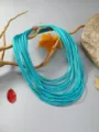 Collar de cordón de cuero azul turquesa multicapa con cierre de metal elegante. - Azul cielo