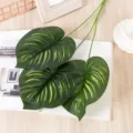 Artificial monstera leaf detail shot, realistic green foliage for home decoration styling. - E68 Dark Green Watermelon Leaf