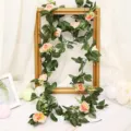 Close-up detail of artificial pink rose vine garland, perfect for home wedding decor and ceiling hanging. - Tea Rose Champagne