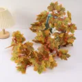 Artificial maple leaf vine for autumn and Halloween decor, detailed view of the hanging plant garland. - Autumn Yellow
