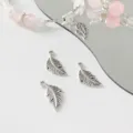 Silver feather charm detail shot, alloy material, ideal for DIY handmade necklaces and bracelets. - Feather / Silver