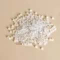 Close-up detail of 3mm white transparent seed beads for DIY handmade jewelry crafting and bracelets. - Style 12