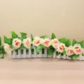 Artificial rose flower vine variant in pink and white with decorative white fence pot. - Champagne 19 Groups of Leaves