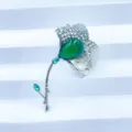Elegant ginkgo leaf brooch with green imitation jade and sparkling rhinestones for chic coats. - Silver