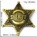 Vintage metal six pointed star sheriff badge brooch pin featuring intricate relief engraving. - Gold