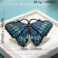 Blue crystal butterfly brooch, black metal alloy rhinestone insect fashion jewelry gift pin. - Blue