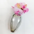 Exquisite silver vase shaped brooch detail, creative floral design accessory for unique style. - Gold Vase Style