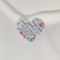 Acrylic heart charm detail showcasing floral print and inspirational Spanish scripture text. - Style 8